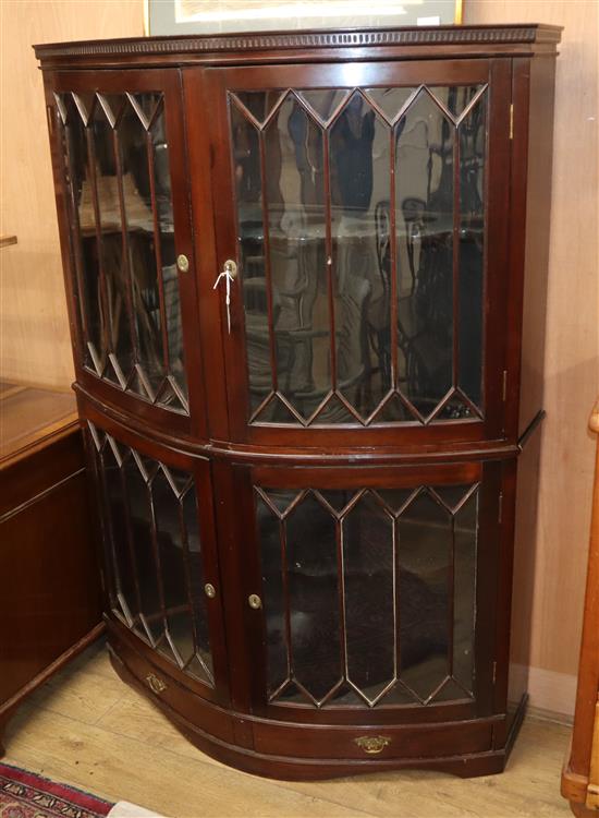 A 1920s mahogany bowfront display cabinet W.125cm